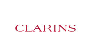 Katie Reddin Clancy Voiceover Artist Actress Comedian And Playwright Clarins Logo
